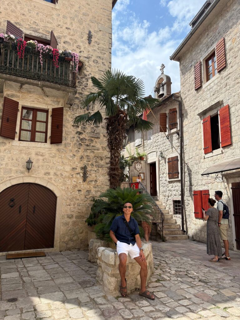 Person sitting down in Old Town Kotor