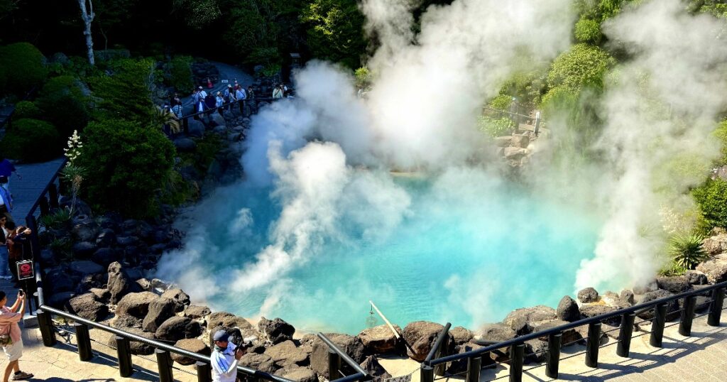 Umi Jigoku, a steaming geothermal hot spring with turquoise water in Beppu, Japan.