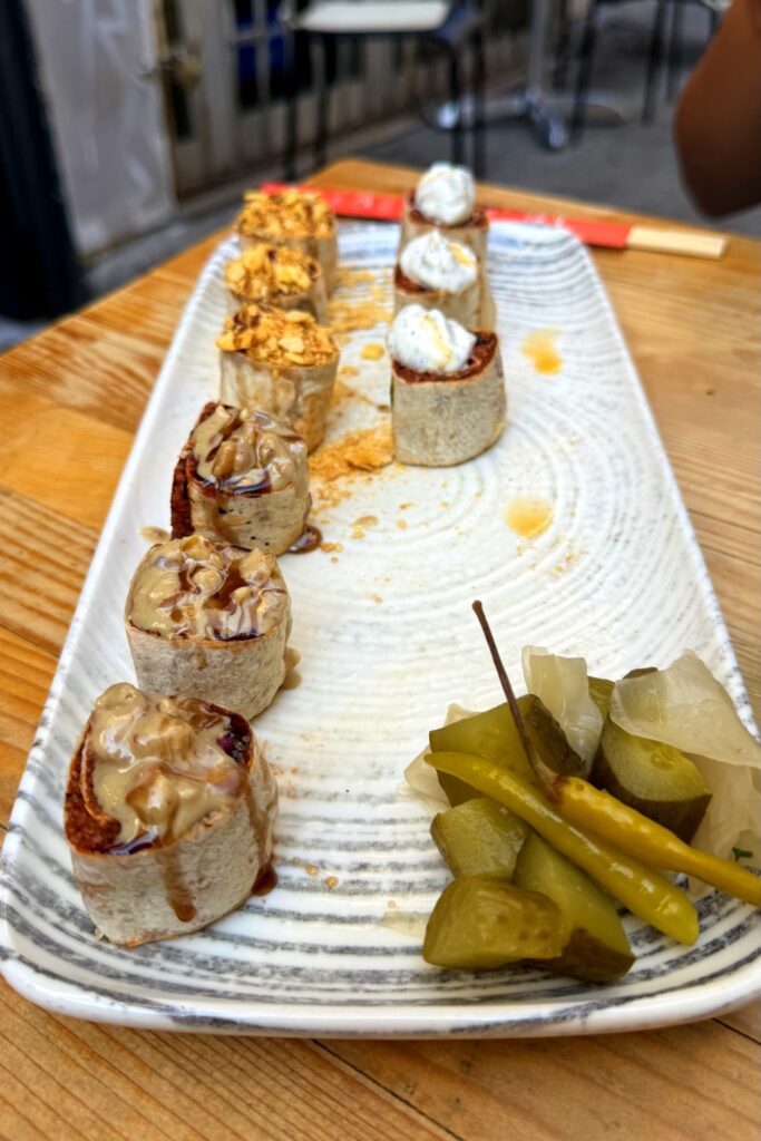 Vegan "meatballs" wrapped sushi-style with tahini.