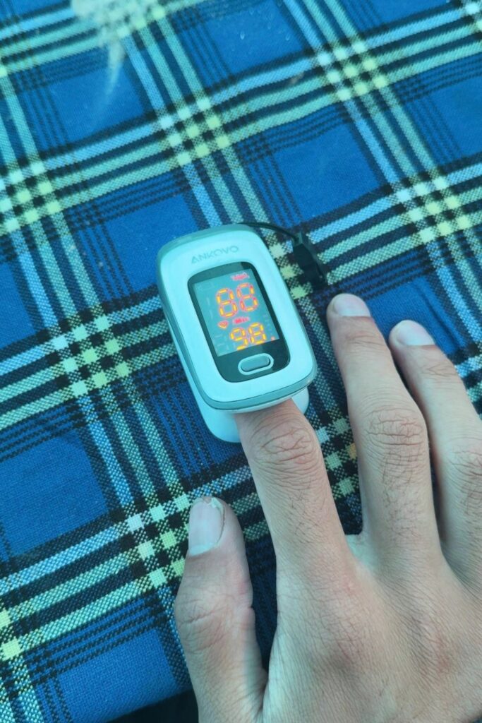 Daily health check on Kilimanjaro using a pulse oximeter to measure blood oxygen levels