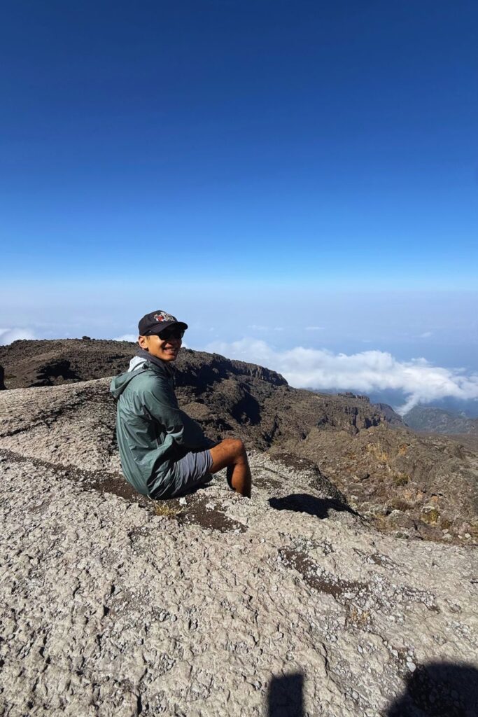 Resting on the summit ridge above the clouds near the top of Kilimanjaro