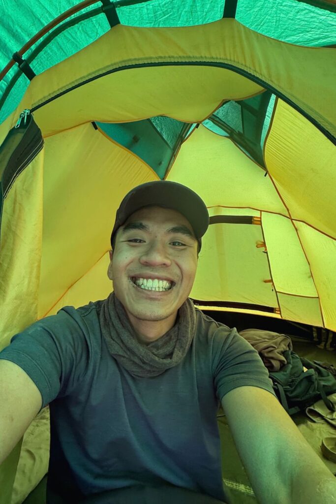 Selfie smiling inside a mountain tent on the first night of the Kilimanjaro trek
