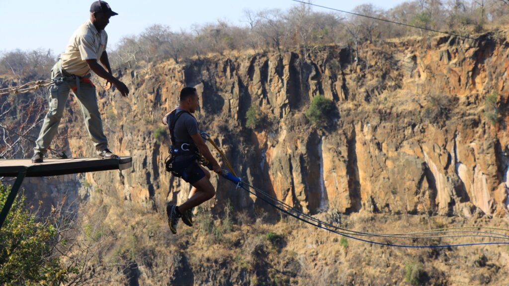 A man about to do the gorge swing, one of the most adrenaline-inducing Victoria Falls activities.