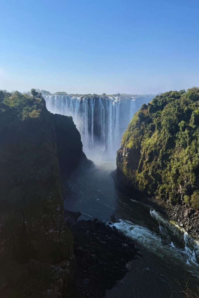 Vertical view of Victoria Falls with the Zambezi River flowing through the gorge below