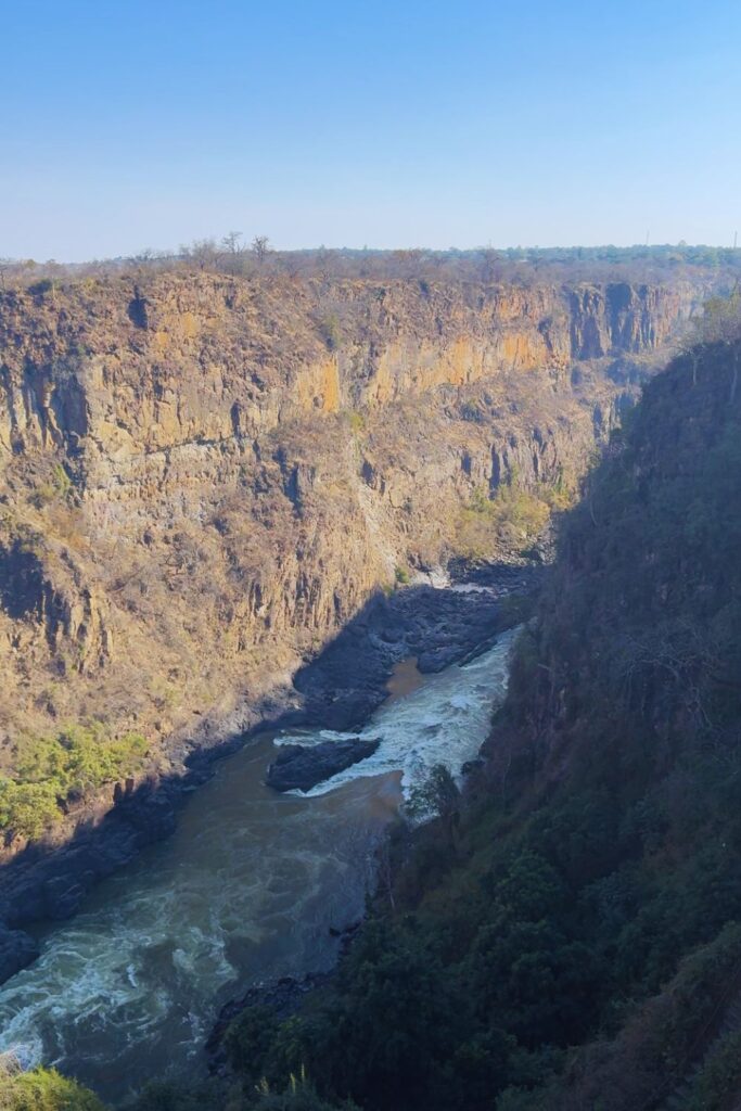 Zambezi River rapids running through the steep rocky gorge near Victoria Falls